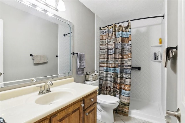 bathroom featuring curtained shower, vanity, toilet, tile patterned floors, and a textured ceiling