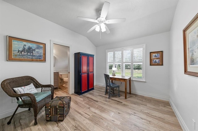 office space with lofted ceiling, ceiling fan, and light wood-type flooring