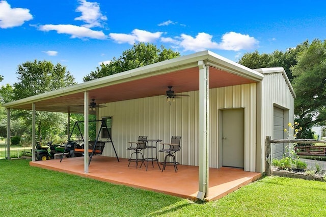 view of outdoor structure featuring a lawn