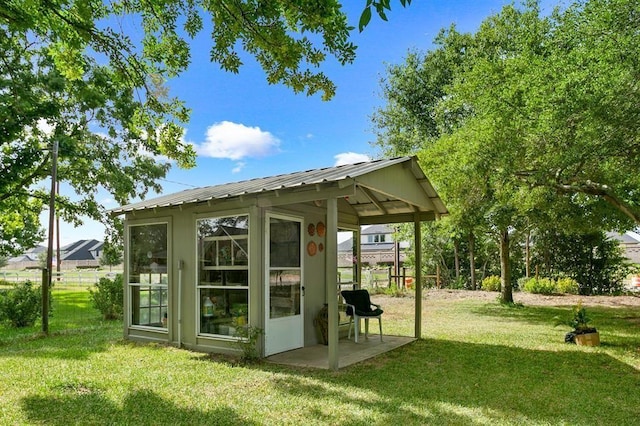 view of outdoor structure with a yard