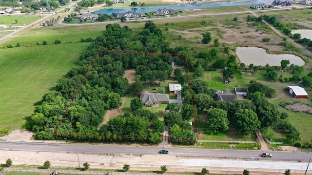 drone / aerial view with a rural view and a water view