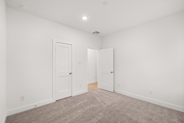 empty room featuring carpet flooring