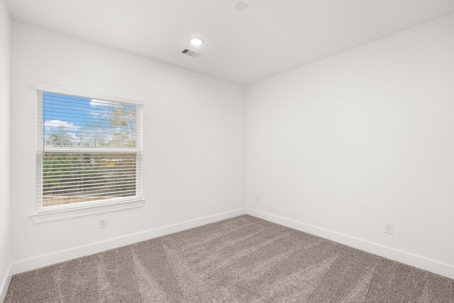 unfurnished room featuring carpet flooring