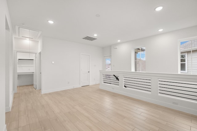 spare room featuring light hardwood / wood-style floors