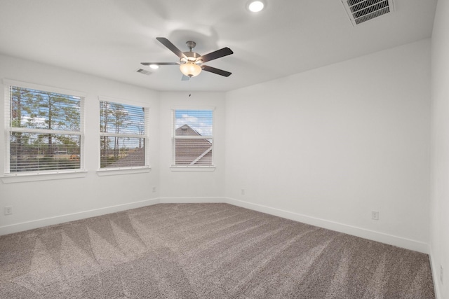 unfurnished room featuring carpet floors and ceiling fan