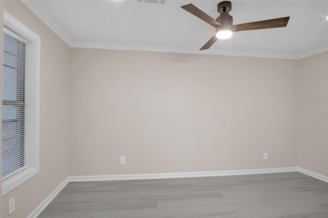 unfurnished room with crown molding, light hardwood / wood-style floors, and ceiling fan