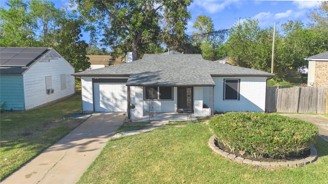 ranch-style house with a garage and a front yard