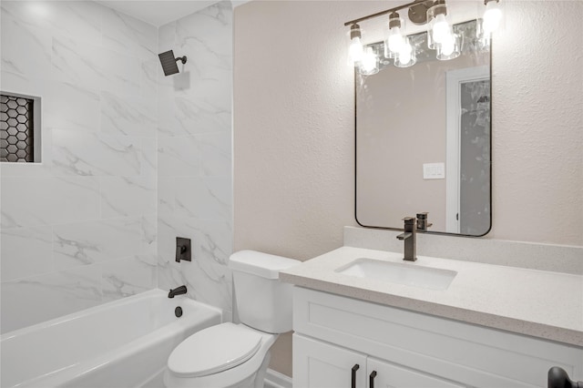 full bathroom with vanity, toilet, and tiled shower / bath