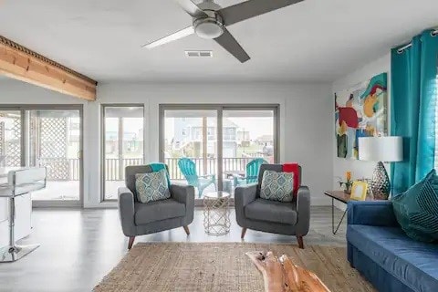 interior space featuring a wealth of natural light, ceiling fan, and light wood-type flooring