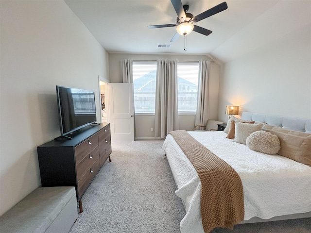 carpeted bedroom with lofted ceiling and ceiling fan