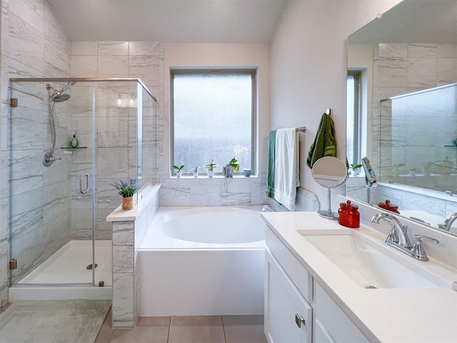 bathroom with vanity, tile patterned floors, and separate shower and tub