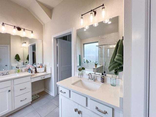 bathroom featuring tile patterned floors, a shower with door, and vanity