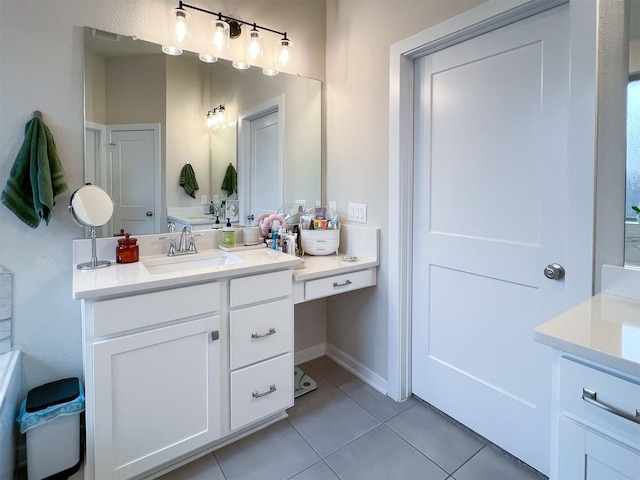 bathroom with tile patterned flooring and vanity