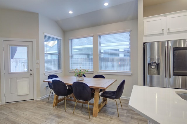 dining area with lofted ceiling