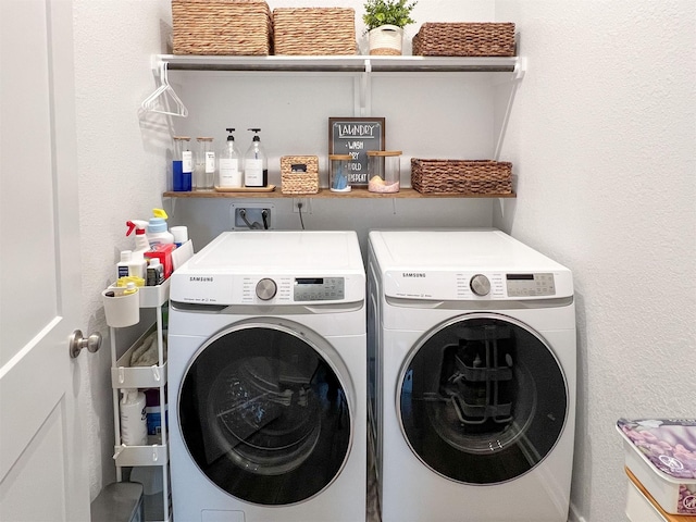 laundry room with washing machine and dryer