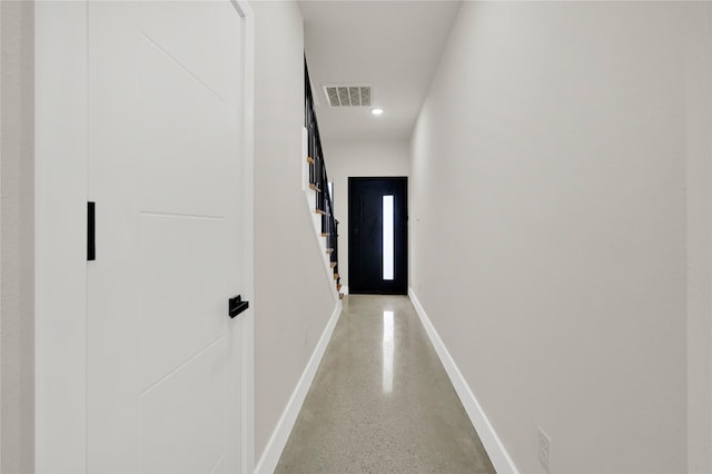 hallway featuring concrete flooring