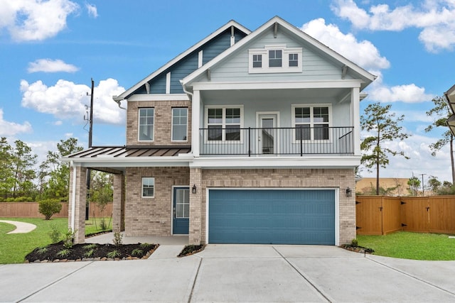 craftsman-style house featuring a garage, a front yard, and a balcony