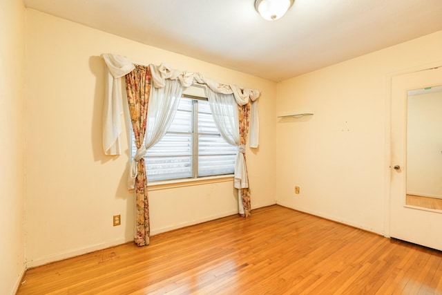 unfurnished room featuring light hardwood / wood-style floors