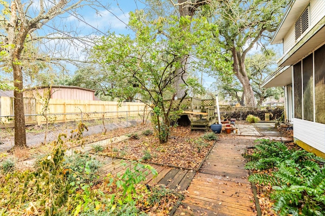 view of yard featuring a wooden deck