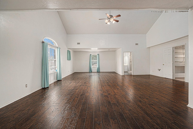 unfurnished room with ceiling fan, dark hardwood / wood-style floors, and high vaulted ceiling