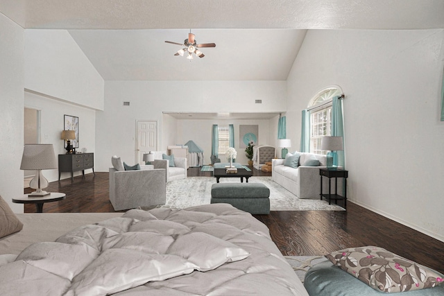 living room featuring wood-type flooring, high vaulted ceiling, and ceiling fan