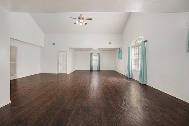 spare room with ceiling fan, high vaulted ceiling, and dark hardwood / wood-style flooring