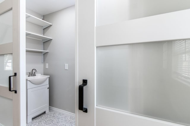 bathroom with tile patterned flooring and vanity