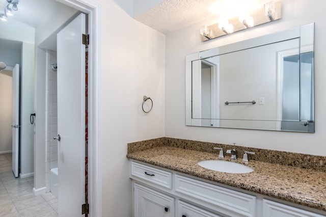 bathroom with vanity, tile patterned floors, and shower / tub combo with curtain