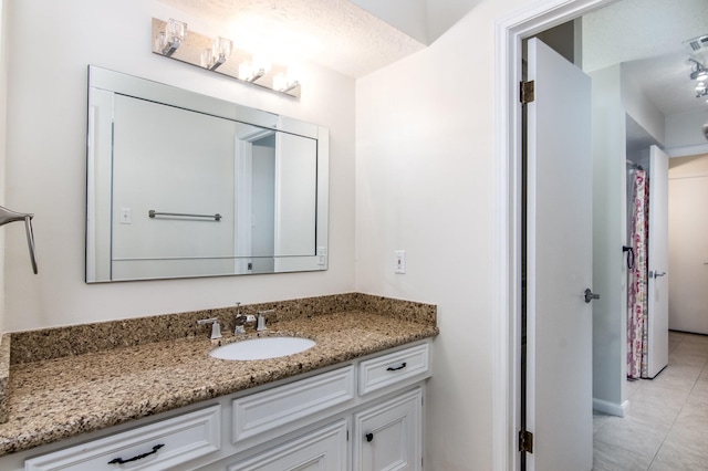 bathroom featuring vanity and tile patterned flooring