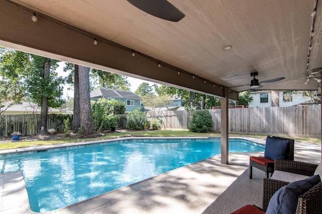 view of pool featuring ceiling fan