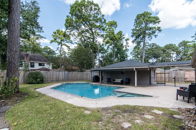 view of swimming pool with an outdoor living space, a lawn, and a patio area