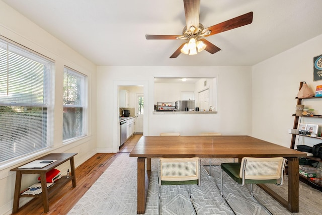 dining space featuring ceiling fan and light hardwood / wood-style floors