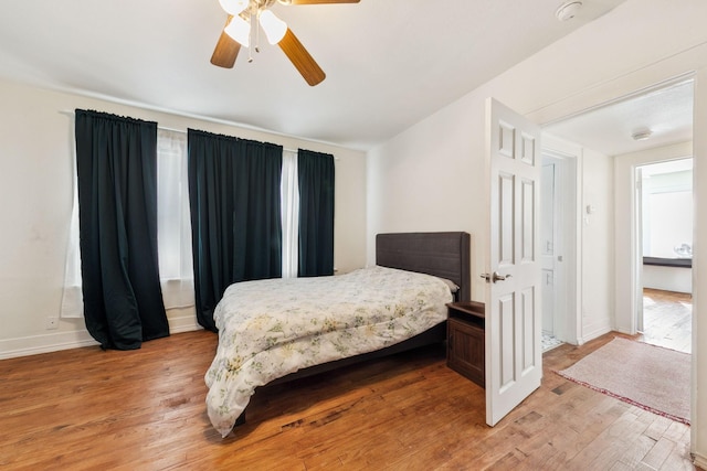 bedroom featuring ceiling fan and light hardwood / wood-style flooring