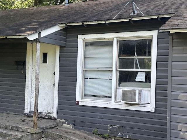 view of side of property with cooling unit