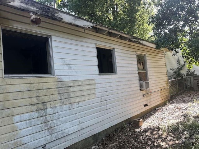 view of side of property with cooling unit