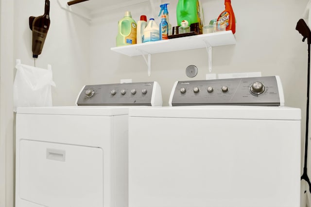 clothes washing area with washer and dryer