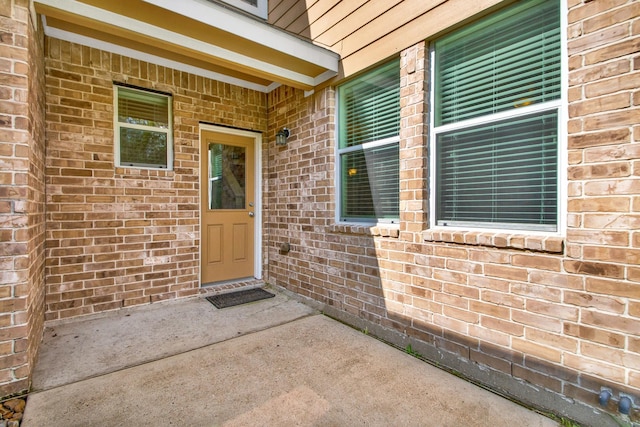 doorway to property with a patio area