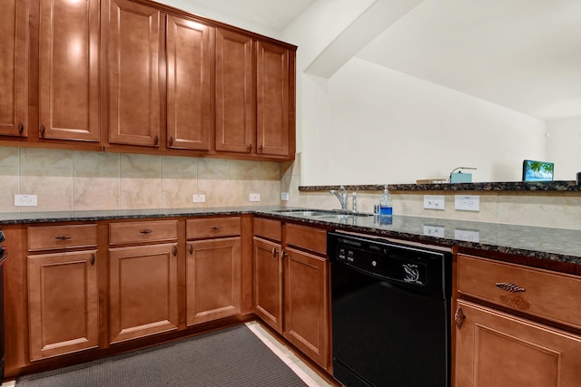 kitchen featuring dark stone countertops, sink, tasteful backsplash, and black dishwasher