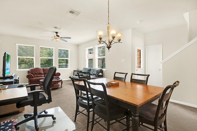 dining room with ceiling fan with notable chandelier and light carpet