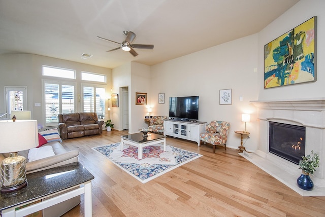 living room with ceiling fan and light hardwood / wood-style floors