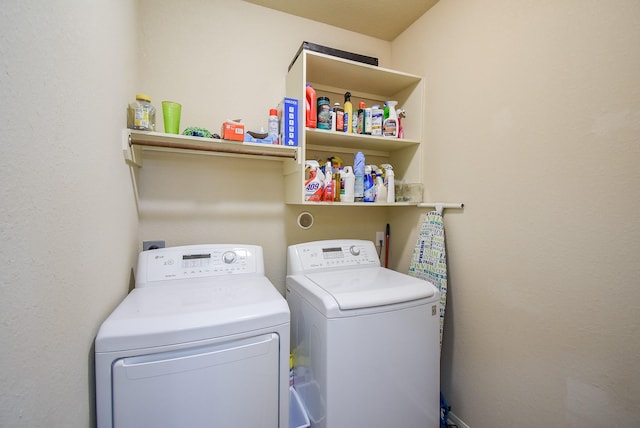 laundry area featuring washing machine and clothes dryer