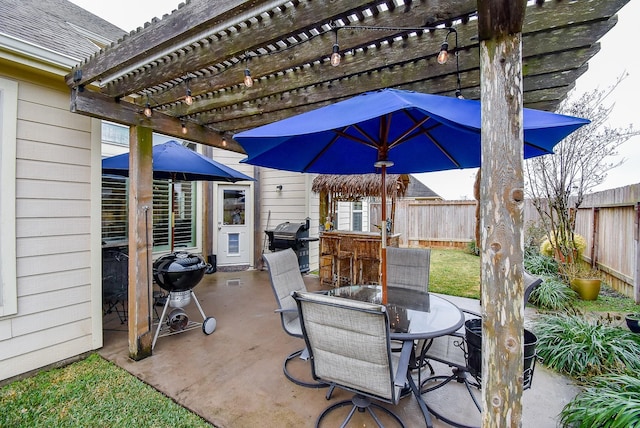 view of patio / terrace featuring a grill, a pergola, and an outdoor bar