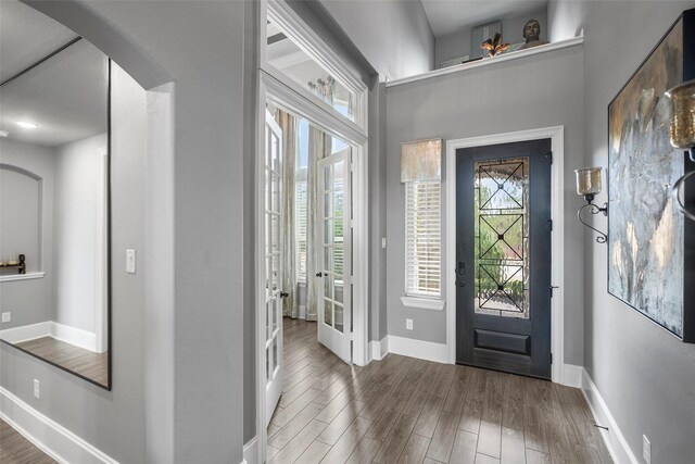 entrance foyer featuring french doors and wood-type flooring