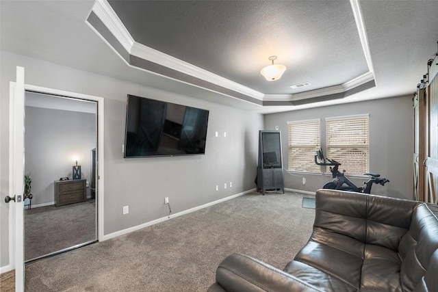 carpeted living room featuring ornamental molding, a tray ceiling, and a textured ceiling