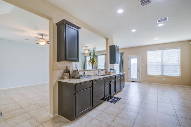 kitchen with plenty of natural light, black dishwasher, sink, and decorative backsplash