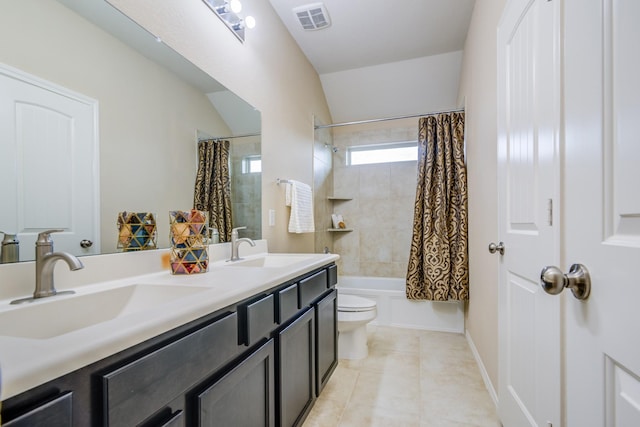 full bathroom featuring vanity, shower / bath combination with curtain, tile patterned floors, and toilet