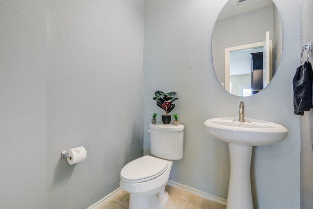 bathroom with tile patterned floors and toilet