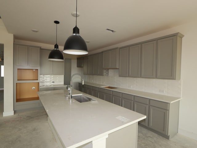 8411 Oceanmist Cove Dr, Cypress, TX 77433 - kitchen with a sink, gray cabinetry, and concrete flooring