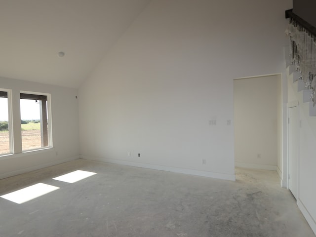 8411 Oceanmist Cove Dr, Cypress, TX 77433 - empty room featuring high vaulted ceiling and baseboards