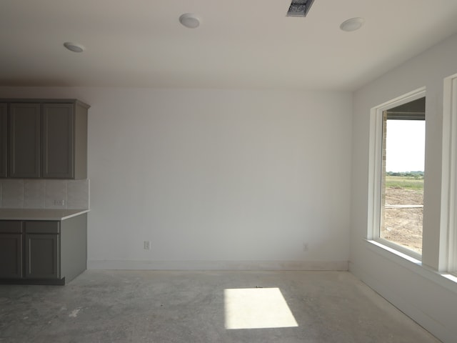 8411 Oceanmist Cove Dr, Cypress, TX 77433 - unfurnished living room with unfinished concrete flooring and baseboards